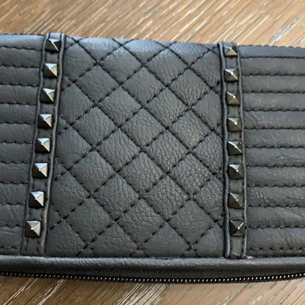 Unbranded black with black brads wristlets